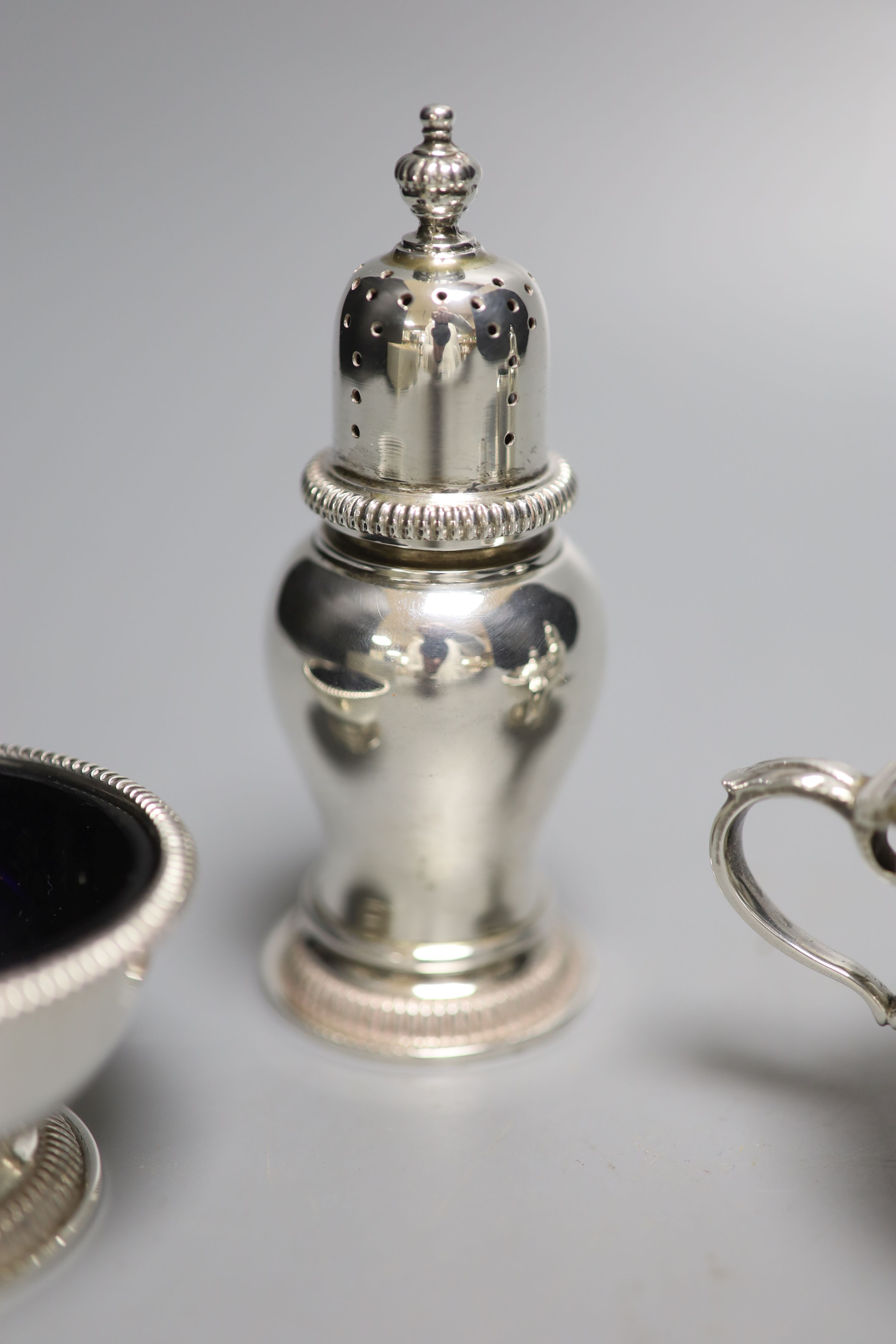 A modern silver five piece condiment set including one spoon, by William Comyns & Sons Ltd, London, 1960 & 1967,